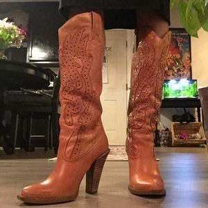 Sexy high heel cowgirl boots.